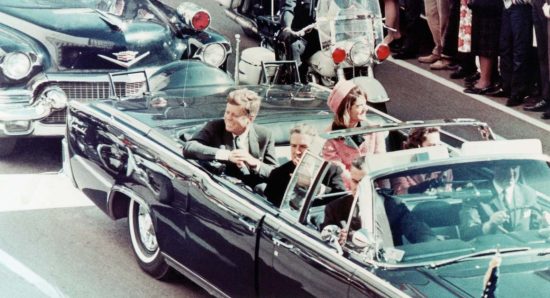 President John F. Kennedy, First Lady Jacqueline Kennedy, and Texas Governor John Connally ride in a motorcade in Dallas, Texas, on November 22, 1963. Moments later the President and Governor were shot by an assassin. (Walt Sisco / Copyright Bettmann/Corbis / AP Images)